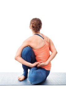 Woman doing Ashtanga Vinyasa Yoga stretching asana Marichyasana D, pose posture dedicated to sage