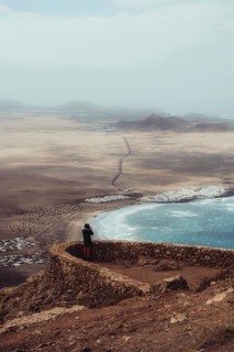 A stunning view of Lanzarote's coastline, showcasing the contrast between the blue ocean and arid