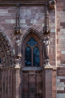 Detailed view of Basel Cathedral with the seducer and the foolish virgin statues, Old Town, Basel,