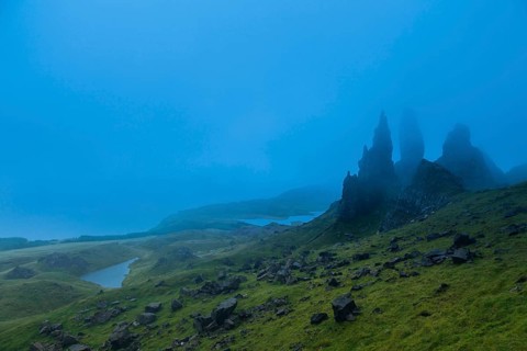 UK. Scotland. Isle of Skye. The Old Man of Storr covered in mist during a storm