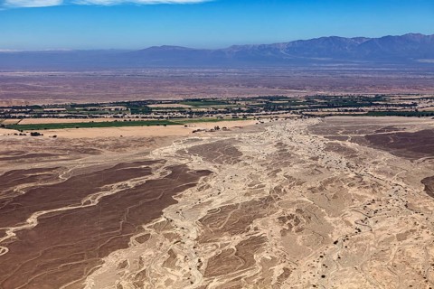Desert landscape with adjacent agricultural land and nearby mountains, The landscape and desert