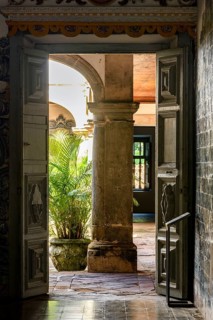Door inside an old baroque church open to its internal courtyard in Olinda, state of Pernambuco,