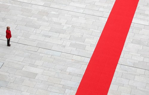 Berlin, DEU, 01.06.12 - Federal Chancellor Angela Merkel stands alone in the courtyard of the