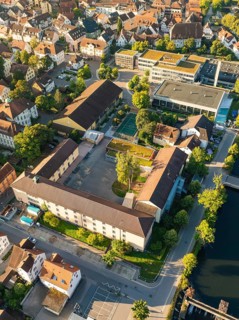 Close-up of an urban area with a river, a bridge and many buildings, Nagold, Black Forest, Germany