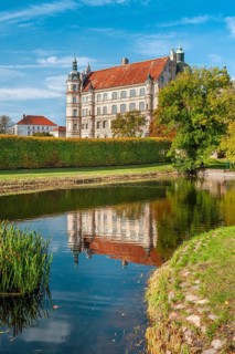 Güstrow Castle in autumn with water spouting, built in the 16th century, Renaissance building,