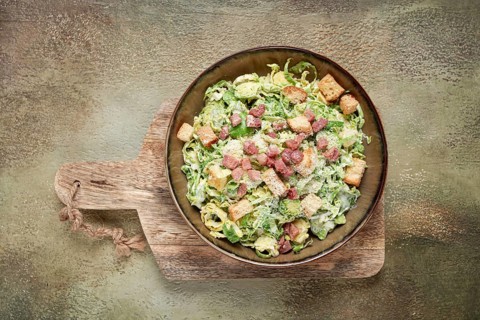Brussels sprouts Caesar salad, with bacon and croutons, healthy food, homemade, no people