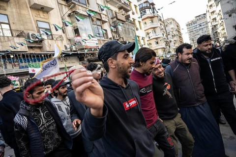 Damascus, Syria. December 7th 2025. Syrians dance the traditional dabke to celebrate one year since