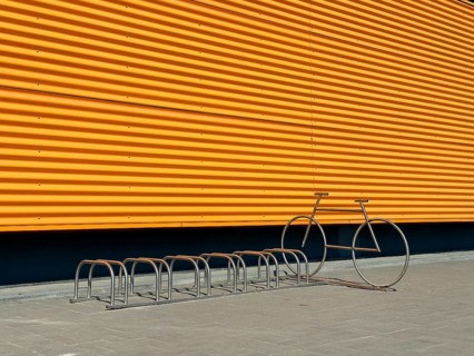 A crisp image showcasing a modern industrial building's vibrant yellow exterior wall, contrasted