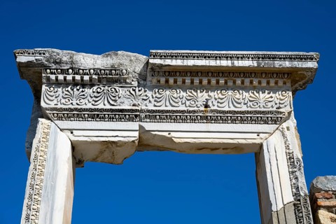 Detail of an ancient decorated capital against a blue sky, Efes, Ephesus, UNESCO World Heritage