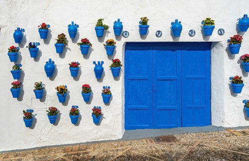 Blue flower pots on whitewashed wall, Castle of Iznajar, Castillo de Iznájar, Andalusia, Spain