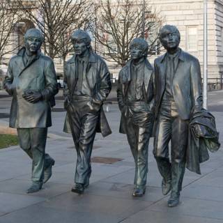 The Beatles statues sculpture by Anthony Edwards, Pier Head, Liverpool, England, UK