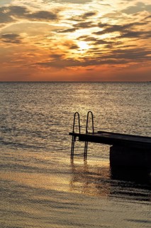 Seaside jetty, bathing spot, sunset, back light, Baltic Sea, Burgsvik, Gotland island, Sweden