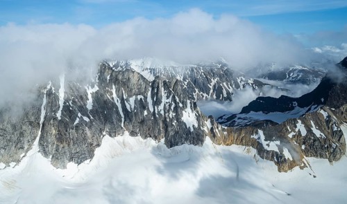 Snow and ice, epic mountains with glaciers, aerial view, Alaska Range, Denali National Park,