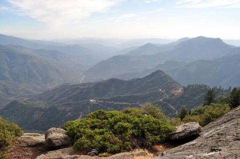 View of wooded valleys and distant mountain ranges under milky skies, Sequoia National Park,