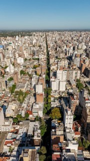 From above, this image captures the expansive cityscape of Rosario, Argentina, showcasing a dense