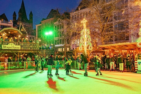 Christmas market Heinzel's winter fairy tale with the ice rink at Heumarkt at dusk, Cologne, North