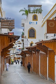 Wooden shutters of closed shops in shopping street on Friday in medina of the city Tangier, Tanger,