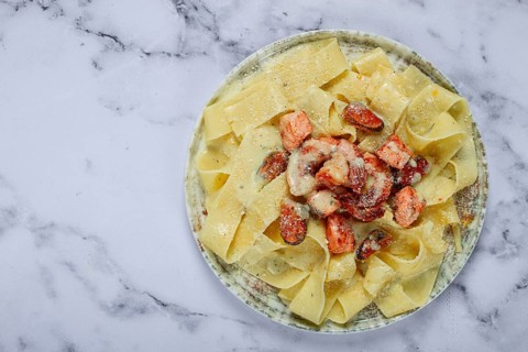 Papardelle pasta in creamy sauce with seafood, homemade, no people