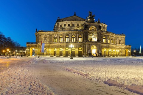 Illuminated Semper Opera House and Theatre Square with snow at dusk, Old Town of Dresden, Saxony,
