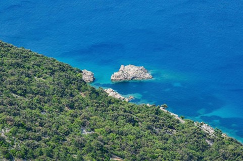 View from Lubenice across the sea with coastal landscape and bays on a sunny day on the island of