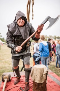 LUBIAZ, POLAND - AUGUST 25, 2018: Monastery Siege - Medieval executioner with the big ax