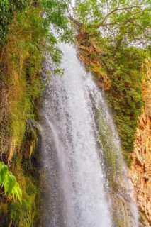 View of the interior of the Iris Grotto at the Cola de Caballo Waterfall in the Monasterio de