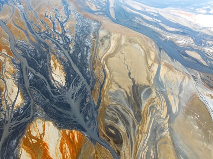 From above, this mesmerizing aerial capture reveals intricate patterns created by river systems,