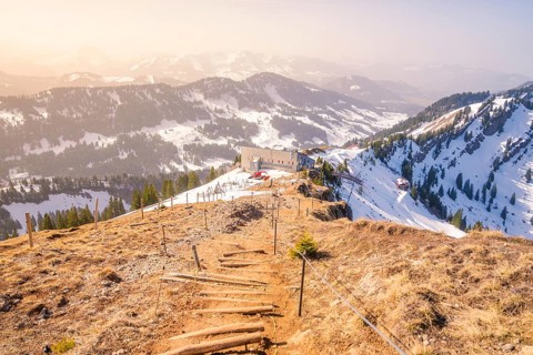 Panoramic view of snow-covered mountains and mountain hut, path in the foreground, Hochgrat