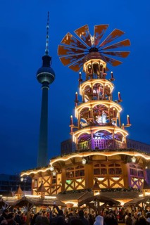 A Christmas pyramid in front of the Berlin TV tower at the Christmas market on Alexanderplatz,