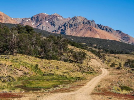 Road Ruta 41, gravel road, arid volcanic landscape, Los Antiguos - Paso Roballo, aerial view,