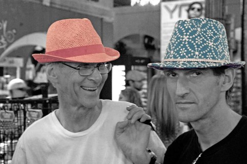 Young men poke hats for fun in a department store, Schwarz Weiss, New Yoprk, USA