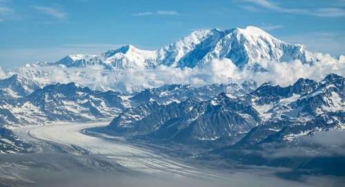 Clouds over high mountains, Mt Foraker with Kahlitna Glacier, aerial view, Alaska Range, Denali