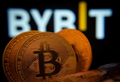 Dhaka, Bangladesh- 15 July 2025: Close-up of Bitcoin coins with the Bybit logo visible on a screen