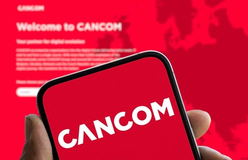 CANCOM logo is displayed on smartphone. Cancom SE is a German company for IT services.