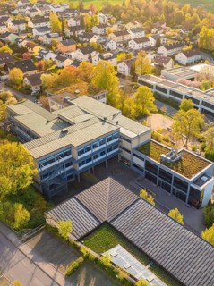 Bird's eye view of the district with modern buildings in autumnal surroundings, Christiane Herzog