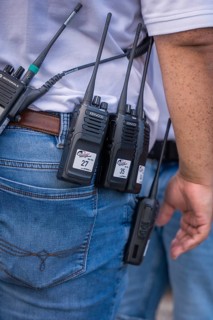 Close-up of radios in the belt pouch of a security guard, Malleparty Böblingen, Germany