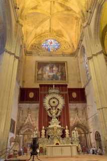 Magnificent altar inside the cathedral with ornate paintings and details, Seville, Andalusia, Spain