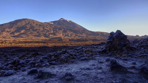 Frosty and rocky volcanic landscape under clear sky with shade, Teide, Parque Nacional del Teide,