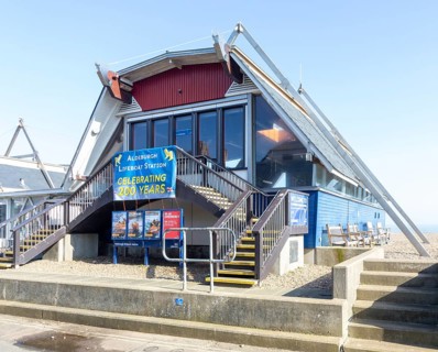 RNLI Lifeboat Station building on beach at Aldeburgh, Suffolk, England, UK - celebrating 200 years,