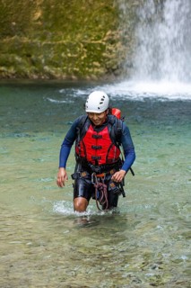 A canyoneer equipped with safety gear explores the enchanting Matacanes Canyon in Nuevo Leon,