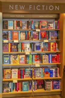 Bookshelves display of New Fiction books inside Waterstones bookshop, Sudbury, Suffolk, England, UK