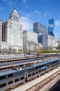 Skyline with METRA commuter train railway at Van Buren Street station in Chicago, USA