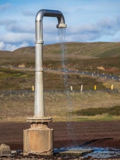 Hot water shower next to the road, near Krafla power plant, art object, Myvatn region, Iceland