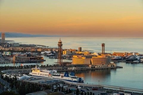 View of the old harbour and the city of Barcelona in the evening light, Spain