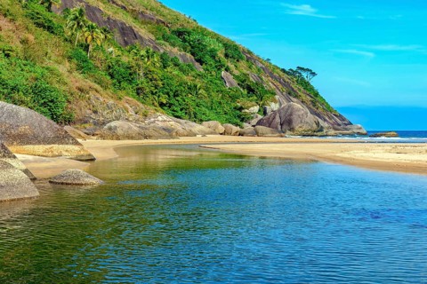River flowing into the sea at Bonete beach in Ilhabela on the north coast of Sao Paulo, Ilhabela,