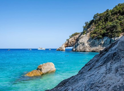 Light blue clear sea on a dream beach on Cala Goloritzé, picturesque rocky coast, cliffs with rock