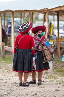 Peruvian woman in traditional traditional costume at the indigenous market in Chinchero, Cusco