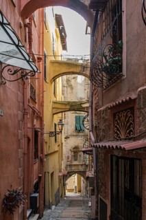 Picturesque narrow alley in the medieval old town of La Pigna in Sanremo, province of Imperia,