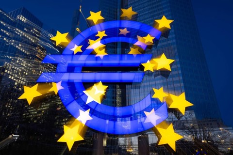 The euro sign in Frankfurt am Main glows in the evening, Frankfurt am Main, Hesse, Germany