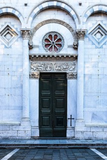 Entrance portal of the church of San Michele in Foro, historic city centre, Lucca, Tuscany, Italy
